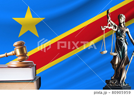 Law and justice in Democratic Republic of the Congo Statue of themis and the gavel of the judge against the background of the flag of Democratic Republic of the Congo Law and justice concept 80905959