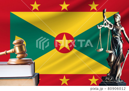 Law and justice in Grenada. Statue of themis and the gavel of the judge against the background of the flag of Grenada. Law and justice concept Law and justice in Grenada. Statue of themis and the gavel of the judge against the background of the flag of Grenada. Law and justice concept 80906012