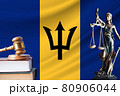 Law and justice in Barbados. Statue of themis and the gavel of the judge against the background of the flag of Barbados. Law and justice concept 80906044