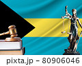 Law and justice in Bahamas. Statue of themis and the gavel of the judge against the background of the flag of Bahamas. Law and justice concept 80906046