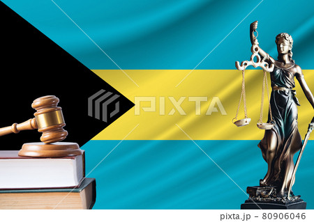 Law and justice in Bahamas. Statue of themis and the gavel of the judge against the background of the flag of Bahamas. Law and justice concept Law and justice in Bahamas. Statue of themis and the gavel of the judge against the background of the flag of Bahamas. Law and justice concept 80906046