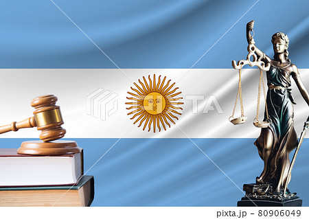 Law and justice in Argentina. Statue of themis and the gavel of the judge against the background of the flag of Argentina. Law and justice concept Law and justice in Argentina. Statue of themis and the gavel of the judge against the background of the flag of Argentina. Law and justice concept 80906049