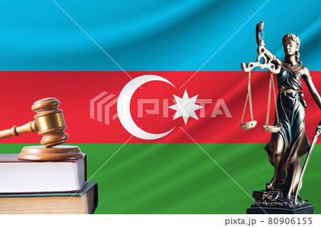 Law and justice in Azerbaijan. Statue of themis and the gavel of the judge against the background of the flag of Azerbaijan. Law and justice concept Law and justice in Azerbaijan. Statue of themis and the gavel of the judge against the background of the flag of Azerbaijan. Law and justice concept 80906155