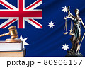 Law and justice in Australia. Statue of themis and the gavel of the judge against the background of the flag of Australia. Law and justice concept 80906157