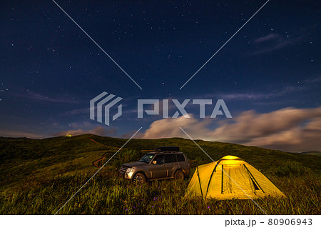 Camping in a meadow under night sky. Camping in a meadow under night sky. 80906943