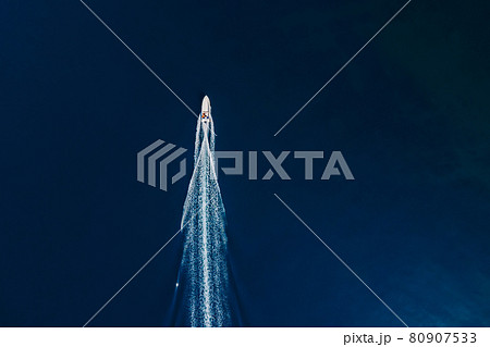 Motor boat is sailing in ocean. Aerial view 80907533