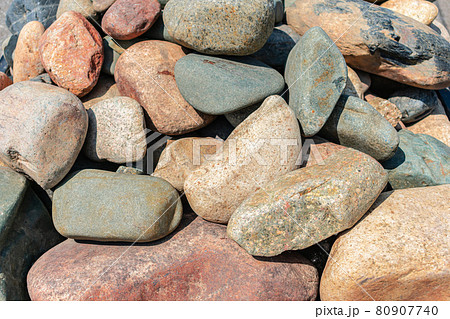 A pile of beautiful sea stones of different textures and colors 80907740