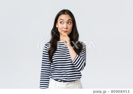 Lifestyle, beauty and fashion, people emotions concept. Thoughtful young asian girl searching for solution, thinking looking away and touching chin while pondering decision Lifestyle, beauty and fashion, people emotions concept. Thoughtful young asian girl searching for solution, thinking looking away and touching chin while pondering decision 80908453