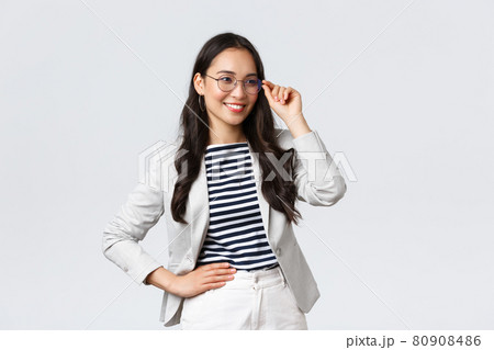 Business, finance and employment, female successful entrepreneurs concept. Confident businesswoman in glasses and white suit ready for meeting, smiling pleased, standing determined 80908486
