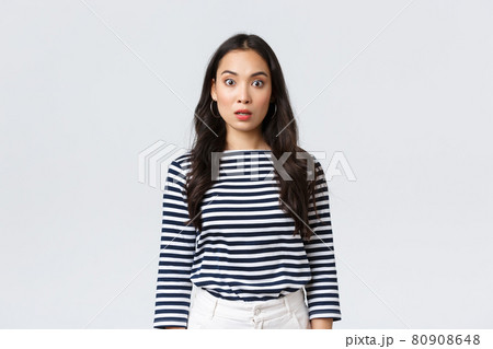 Lifestyle, people emotions and casual concept. Shocked and startled asian woman open mouth, widen eyes at camera when find out terrible concerning news, stand stupor white background Lifestyle, people emotions and casual concept. Shocked and startled asian woman open mouth, widen eyes at camera when find out terrible concerning news, stand stupor white background 80908648