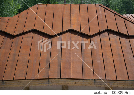 Rusty red metal slope of a roof Rusty red metal slope of a roof 80909969
