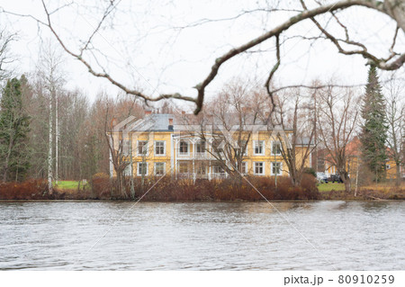 KOUVOLA, FINLAND - NOVEMBER 5, 2018: Beautiful wooden Rabbelugn Manor - Takamaan Kartano in autumn day. Wrede family house was built in 1820 on the river Kymijoki bank KOUVOLA, FINLAND - NOVEMBER 5, 2018: Beautiful wooden Rabbelugn Manor - Takamaan Kartano in autumn day. Wrede family house was built in 1820 on the river Kymijoki bank 80910259