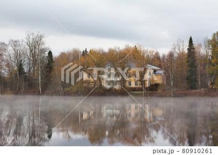 KOUVOLA, FINLAND - OCTOBER 23, 2018: Beautiful wooden Rabbelugn Manor - Takamaan Kartano in fog autumn day. Wrede family house was built in 1820 on the river Kymijoki bank 80910261