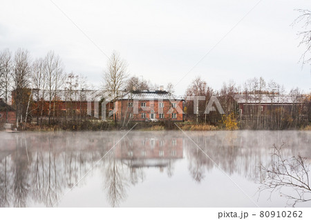 KOUVOLA, FINLAND - OCTOBER 23, 2018: Beautiful wooden Rabbelugn Manor - Takamaan Kartano in fog autumn day. Wrede family house was built in 1820 on the river Kymijoki bank 80910262