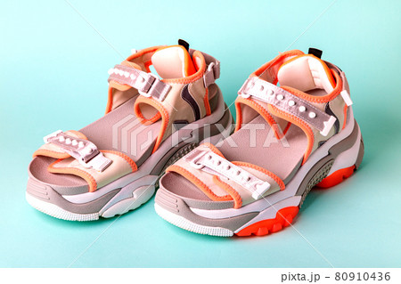Women's, fashionable, sports sandals with orange accents on a blue background. 80910436