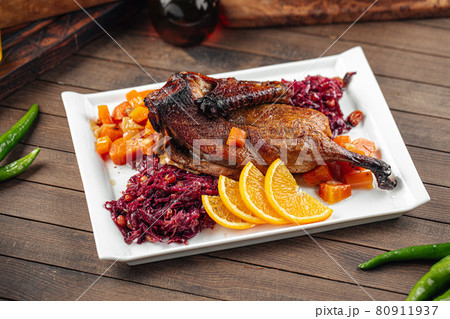 Dish of roast peking duck with different salads 80911937