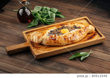Georgian adjarian khachapuri with egg yolk 80912046