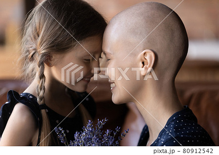 Happy grateful mom with cancer and sweet little daughter kid 80912542