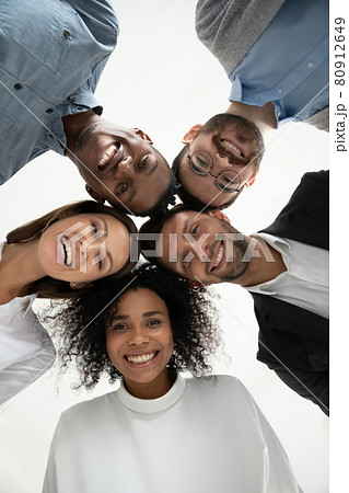 Low angle portrait of smiling diverse employees together Low angle portrait of smiling diverse employees together 80912649