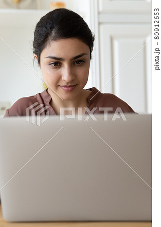 Narrow view of Indian woman use laptop 80912653