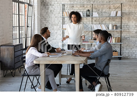 Successful African American female boss lead meeting with colleagues Successful African American female boss lead meeting with colleagues 80912739