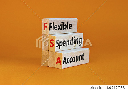 FSA flexible spending account symbol. Concept words FSA flexible spending account on wooden blocks on a beautiful orange background. Business and FSA flexible spending account concept. 80912778