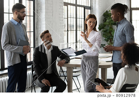 Young diverse businesspeople engaged in team thinking in office Young diverse businesspeople engaged in team thinking in office 80912978