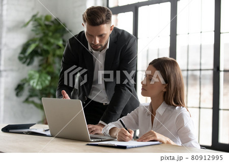 Diverse businesspeople collaborate brainstorm on laptop in office 80912995