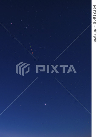 Bright red-green meteor of Perseid flow in the night sky Bright red-green meteor of Perseid flow in the night sky 80913264