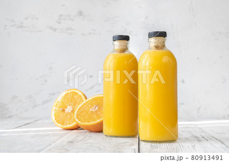 Two bottles of orange juice 80913491