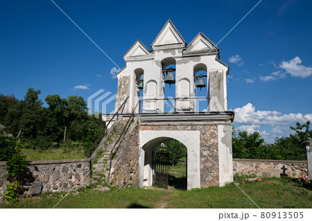 Old bell tower of ancient catholic church of the Annunciation of the Blessed Virgin Mary, Vishnevo, Minsk region, Belarus. 80913505