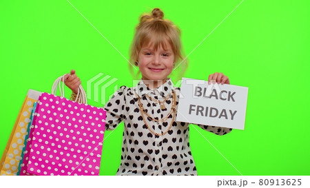 Kid child girl showing Black Friday banner text, advertising discounts, low prices, shopping 80913625