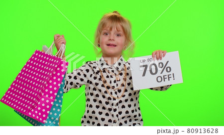 Kid child girl showing shopping bags and Up To 70 Percent Off inscriptions banner text, Black Friday 80913628