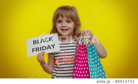 Kid child girl showing Black Friday banner text, advertising discounts, low prices, shopping 80913731