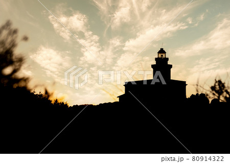 Silhouette view of lighthouse in Capo Testa at sunset - Sardinia 80914322