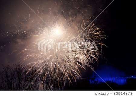 NIAGARA FALLS, ONTARIO, CANADA - MAY 20th 2018: Niagara Falls lit at night by colorful lights with fireworks NIAGARA FALLS, ONTARIO, CANADA - MAY 20th 2018: Niagara Falls lit at night by colorful lights with fireworks 80914373