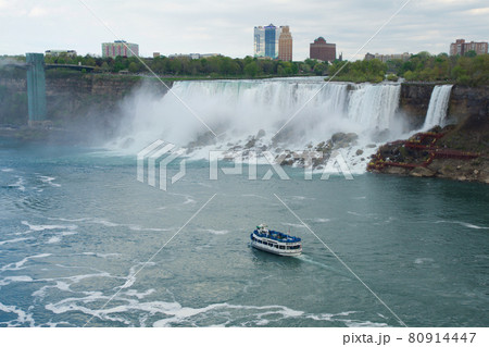 NIAGARA FALLS, ONTARIO, CANADA - MAY 20th 2018: View of the American Falls is the second-largest of the three waterfalls that together are known as Niagara Falls on the Niagara River along the Canada NIAGARA FALLS, ONTARIO, CANADA - MAY 20th 2018: View of the American Falls is the second-largest of the three waterfalls that together are known as Niagara Falls on the Niagara River along the Canada 80914447
