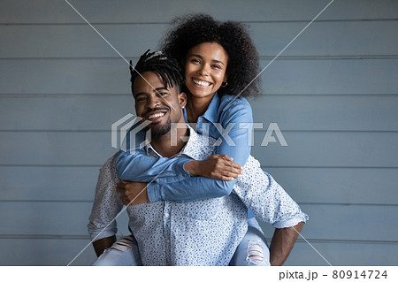 Portrait of happy ethnic couple hugging embracing Portrait of happy ethnic couple hugging embracing 80914724
