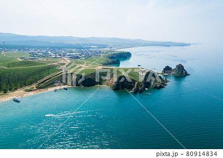 Olkhon Island, the largest island in Lake Baikal in eastern Siberia. Shamanka Rock on Baikal lake near Khuzhir at Olkhon island in Siberia, Russia. Olkhon Island, the largest island in Lake Baikal in eastern Siberia. Shamanka Rock on Baikal lake near Khuzhir at Olkhon island in Siberia, Russia. 80914834