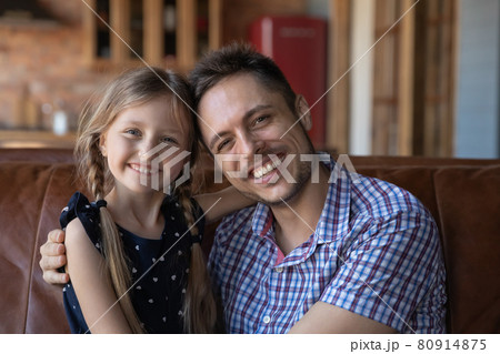 Head shot family portrait of happy dad hugging little daughter 80914875