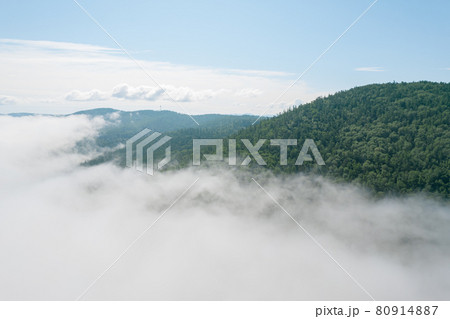 Flying through the clouds above mountain tops. High peaks wonderful morning sunrise natural Landscape 80914887