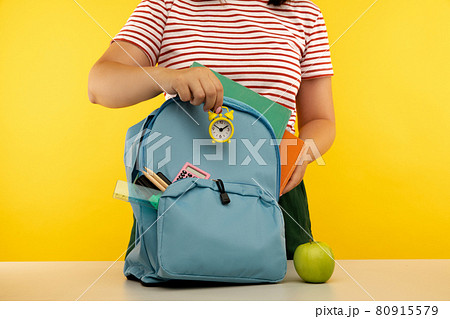 Young girl preparing for school. Education concept Young girl preparing for school. Education concept 80915579