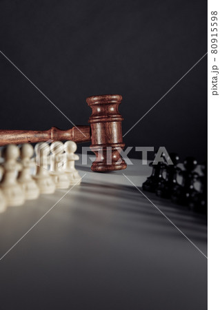 Chess pieces and law gavel. Vertical image Chess pieces and law gavel. Vertical image 80915598
