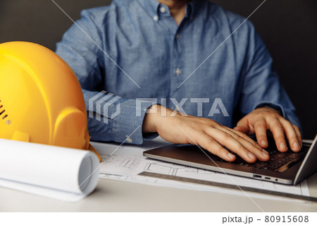 Construction engineer working with laptop at his office Construction engineer working with laptop at his office 80915608