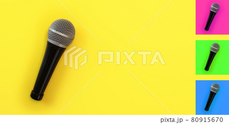 Top down view, microphone on yellow board with space for text on right. Background colour can be easily changed with hue/saturation tool. 80915670