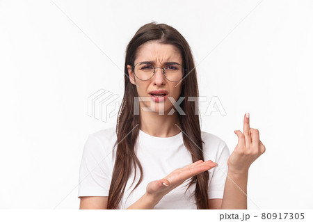 Close-up portrait of desperate sad young woman in glasses, complaining friend that boyfriend didnt made proposal, pointing on finger without ring, whining and sobbing, want be bride Close-up portrait of desperate sad young woman in glasses, complaining friend that boyfriend didnt made proposal, pointing on finger without ring, whining and sobbing, want be bride 80917305