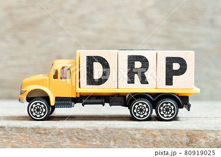Toy truck hold alphabet letter block in word DRP (Abbreviation of Disaster recovery plan, Distribution resource planning, Dividend reinvestment plan, Direct Repair Program or Digital Remaster Toy truck hold alphabet letter block in word DRP (Abbreviation of Disaster recovery plan, Distribution resource planning, Dividend reinvestment plan, Direct Repair Program or Digital Remaster 80919025