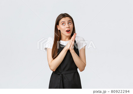 Grocery store employees, small business and coffee shops concept. Excited dreamy female cafe worker having interesting idea for new summer menu, rubbing hands and looking left intrigued 80922294