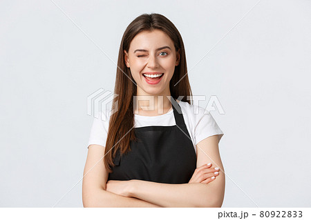 Employees, job employment, small business and coffee shop concept. Cheerful cute cafe staff in black apron guarantee quality invite clients, wink and smiling self-assured Employees, job employment, small business and coffee shop concept. Cheerful cute cafe staff in black apron guarantee quality invite clients, wink and smiling self-assured 80922833