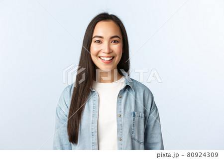 Lifestyle, people emotions and beauty concept. Smiling good-looking asian female student looking camera pleased. Girl in college starting online courses. Woman in casual clothes grinning 80924309